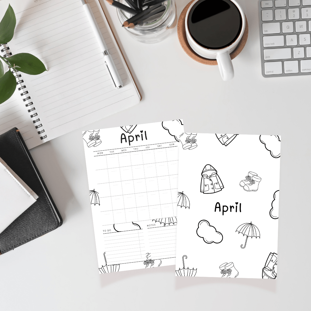 April calendar page with weather-themed illustrations on a desk with office supplies.