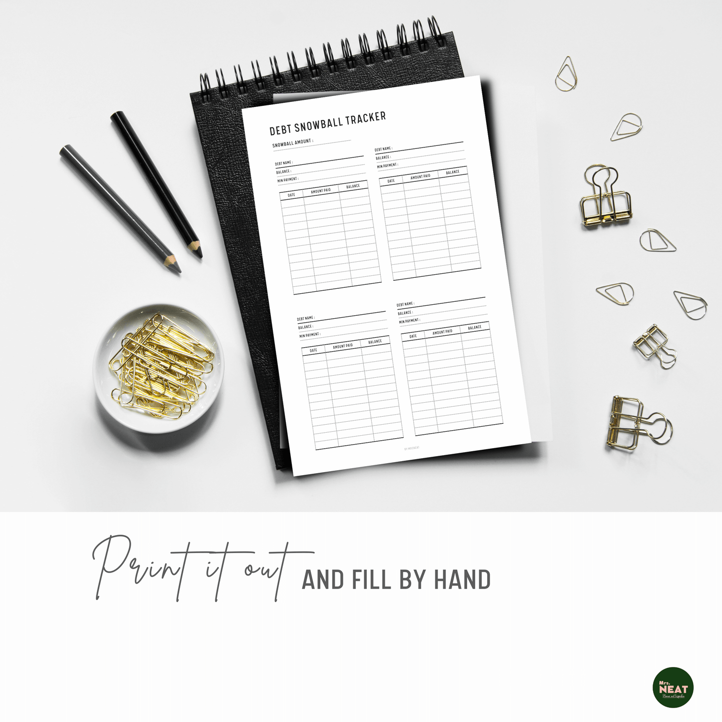 Clean and Minimalist Debt Snowball Tracker printed out and put on the black book with aesthetic stationery surround