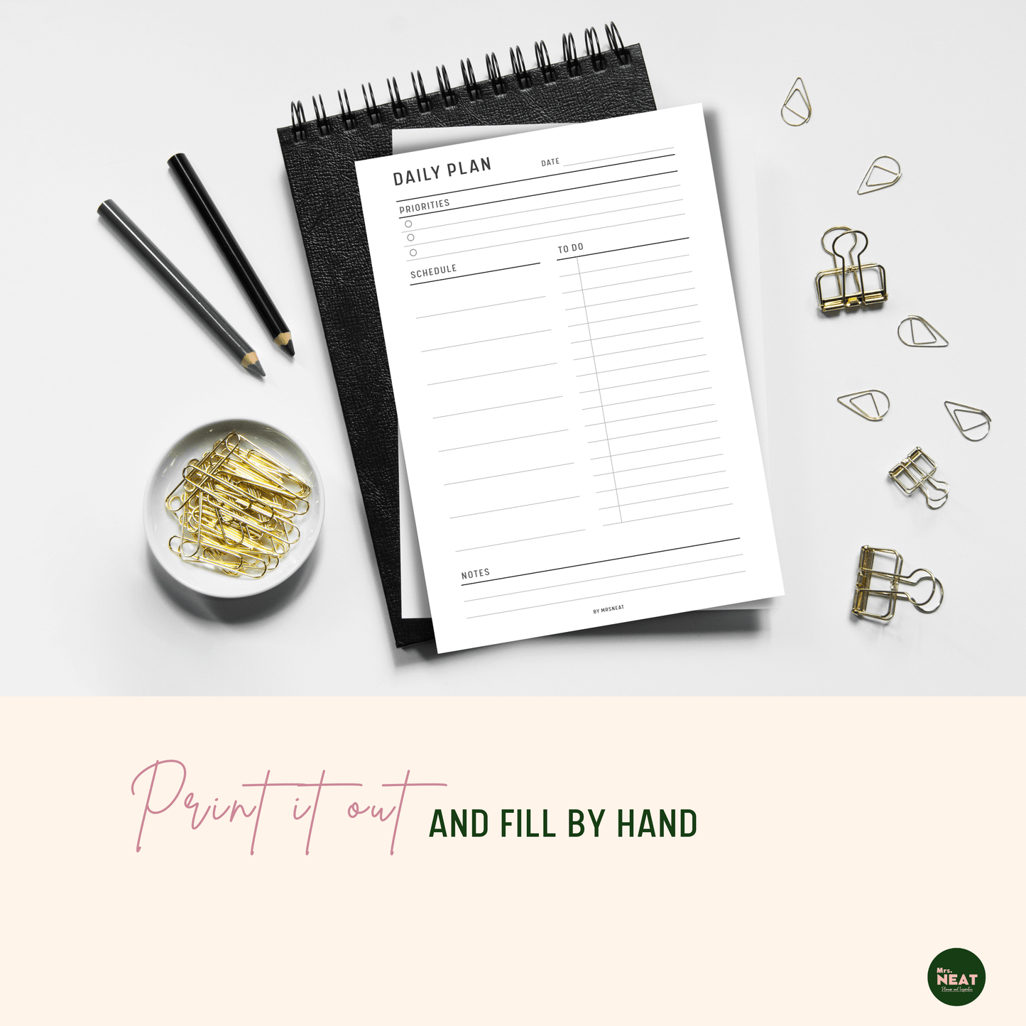 Minimalist Daily Planner printed out and put on black book with aesthetic stationery surround