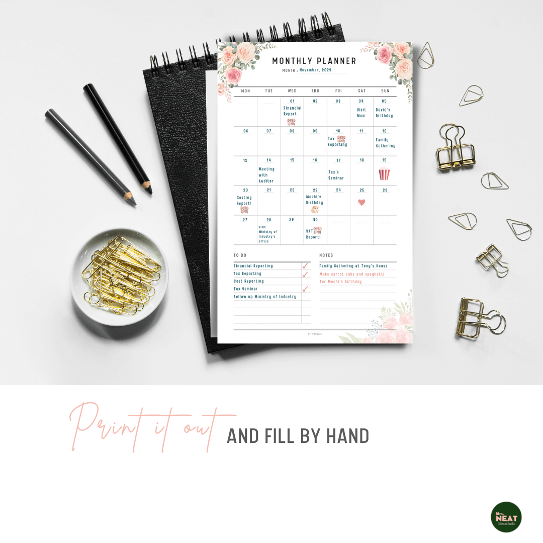 Pink Floral Monthly Printable Planner printed out on the paper with stationery surround
