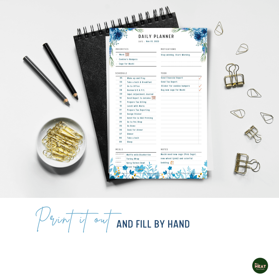 Blue Floral Daily Planner Printable Printed out on the paper with stationery surround