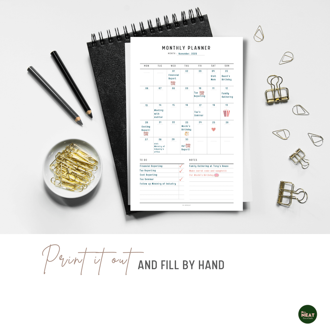 Monthly Planner Printable printed out on the paper with stationery surround