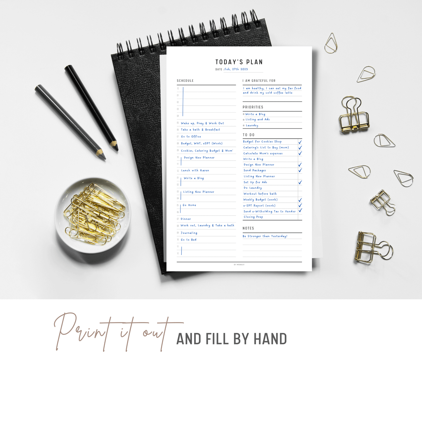 24 Hour Daily Planner Printable printed out on the paper with stationery surround