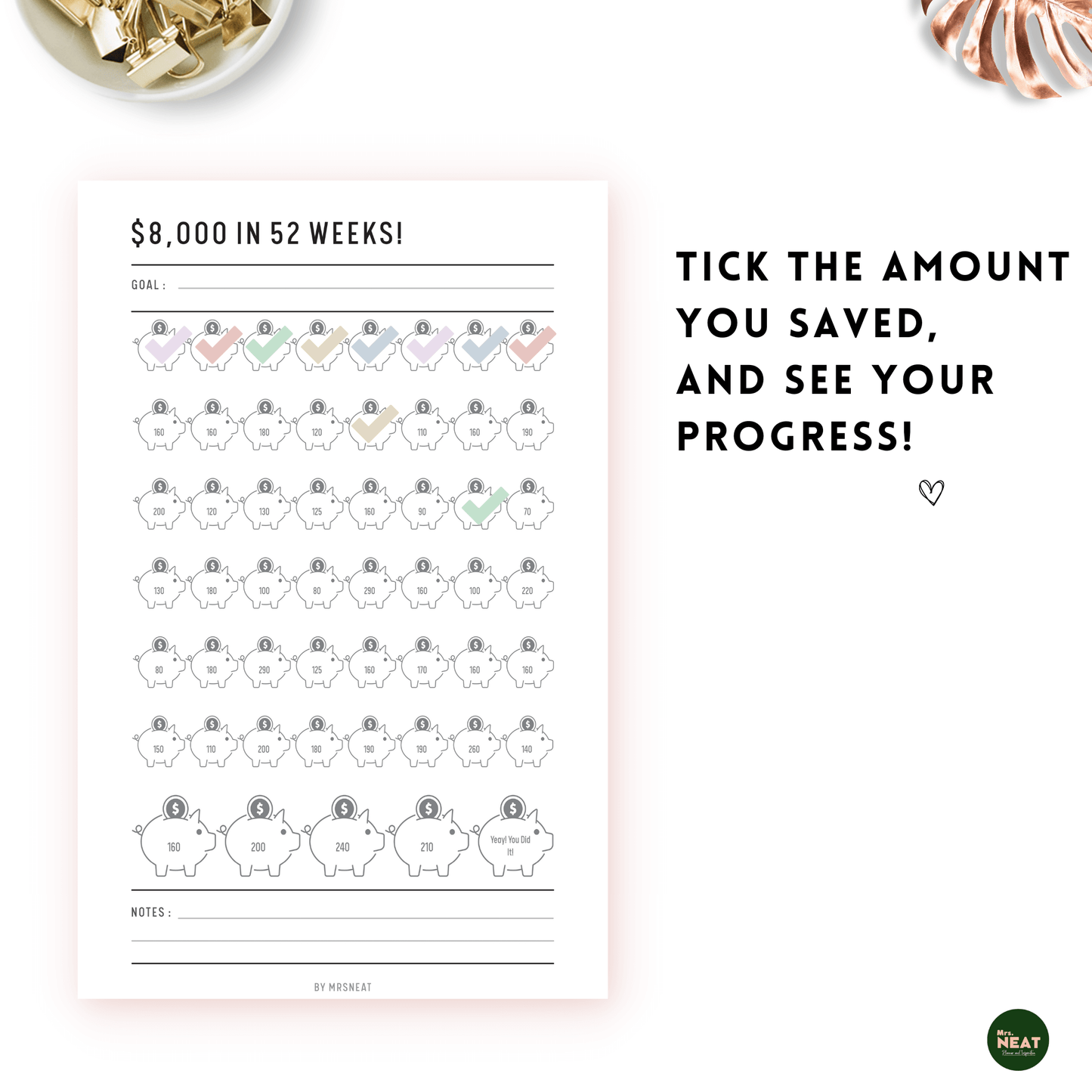 Colorful Piggy bank on Money Saving Challenge Planner to save $8000 in 52 weeks