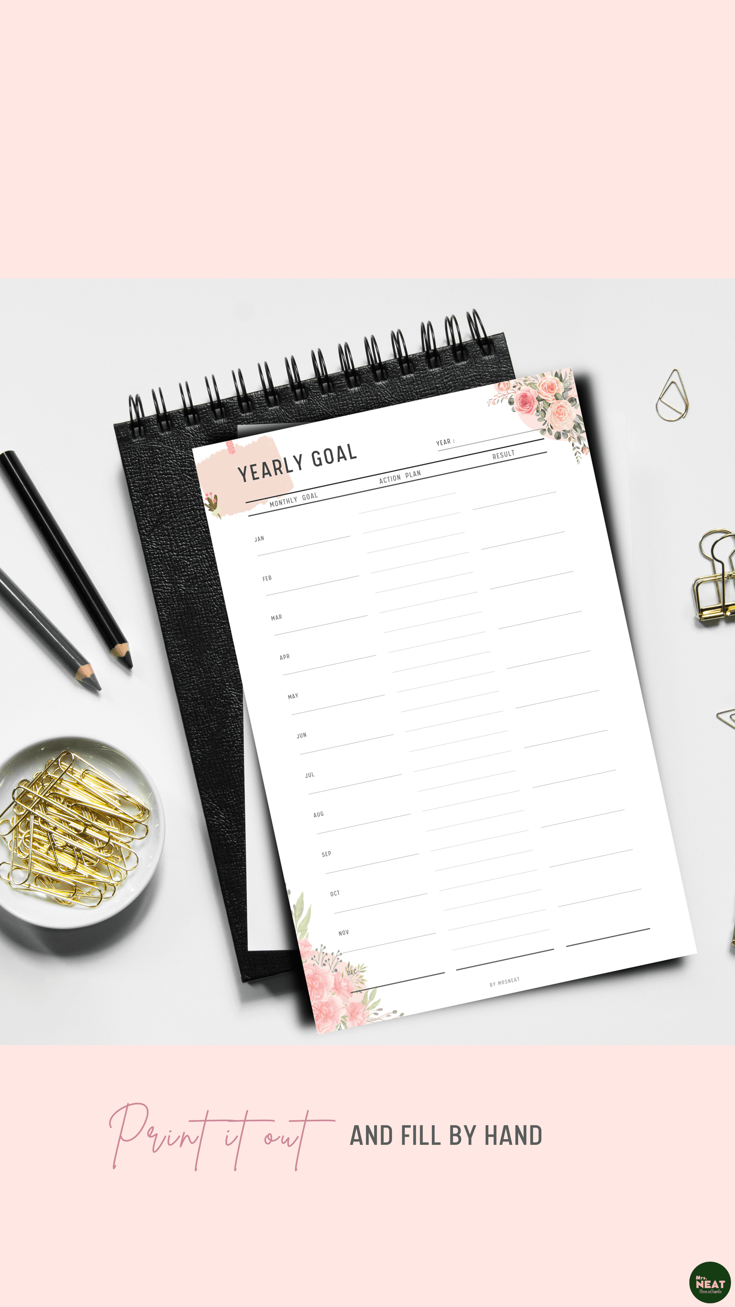 Floral Yearly Goal Planner printed out and put on the black book with aesthetic stationery surround