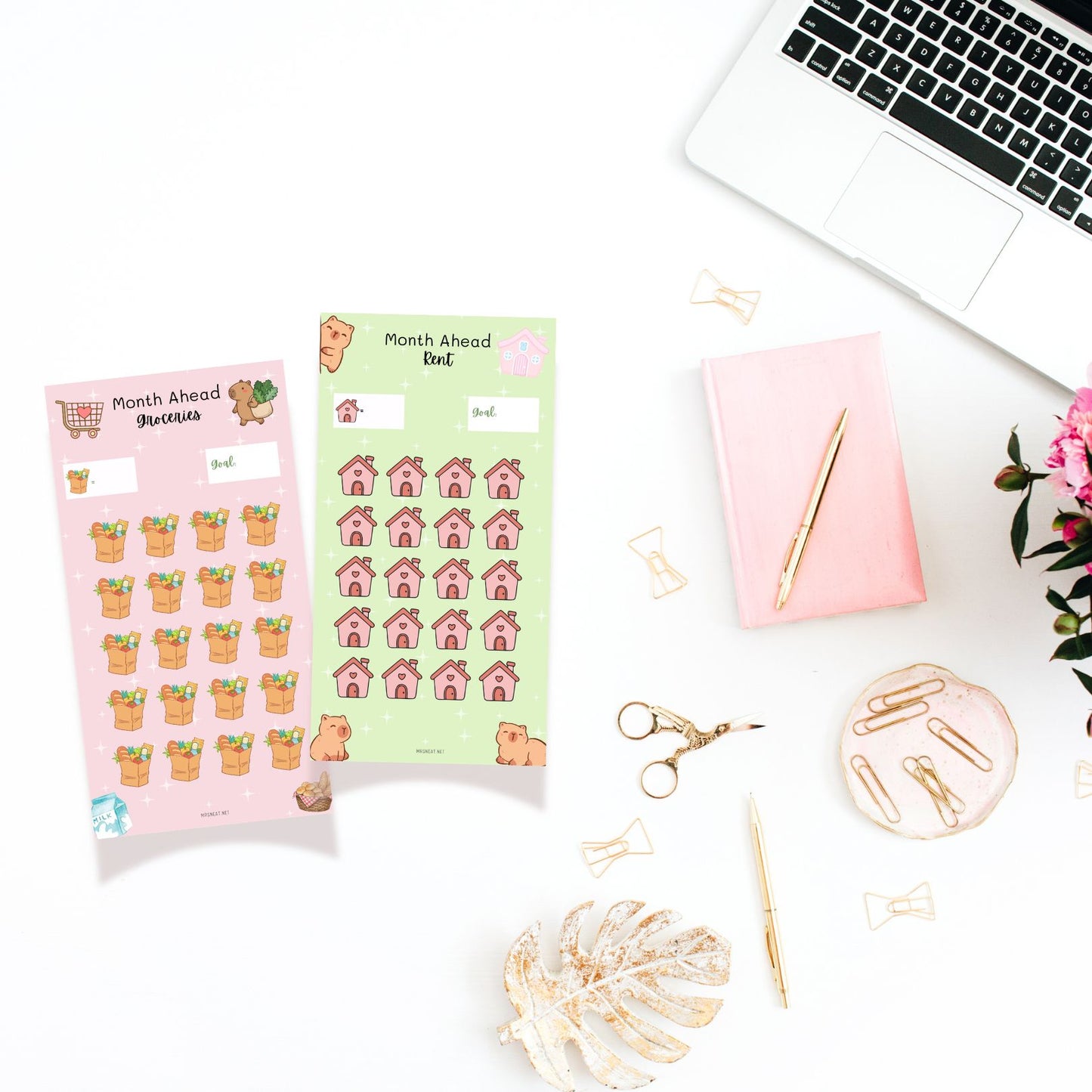 Two packs of planner stickers on a desk with a laptop, pen, and decorative items.