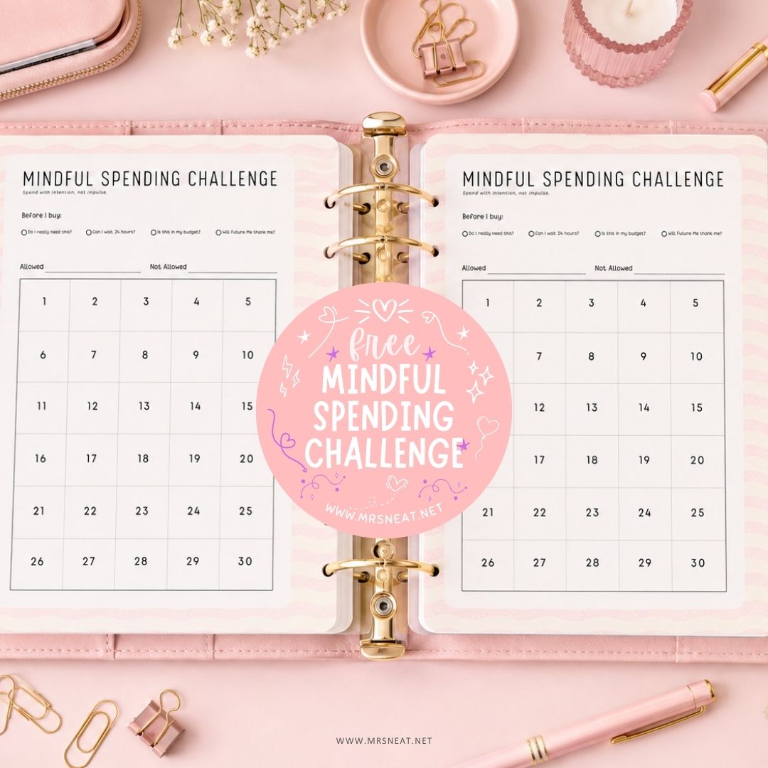 Free Mindful Spending Challenge printable displayed in a budget binder