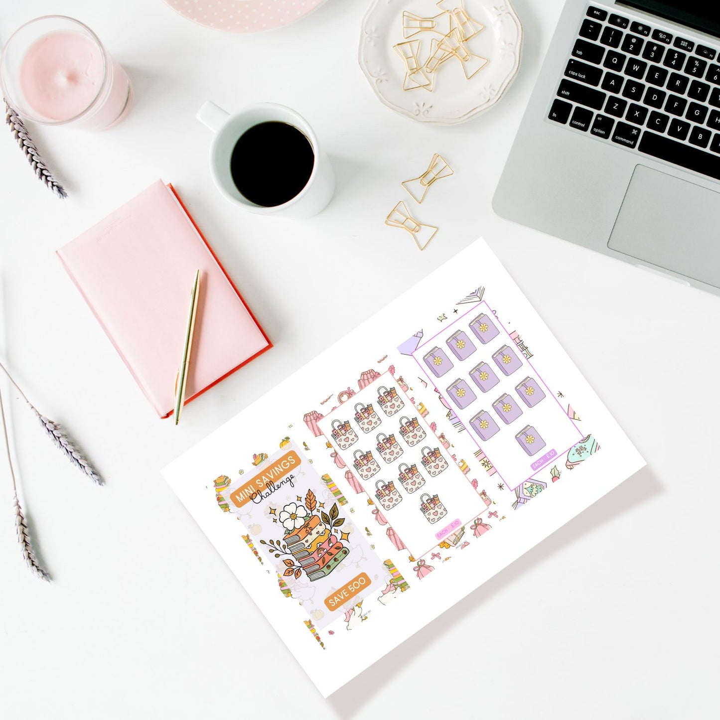 Sheet of planner stickers on a desk with a laptop, notebook, and coffee.