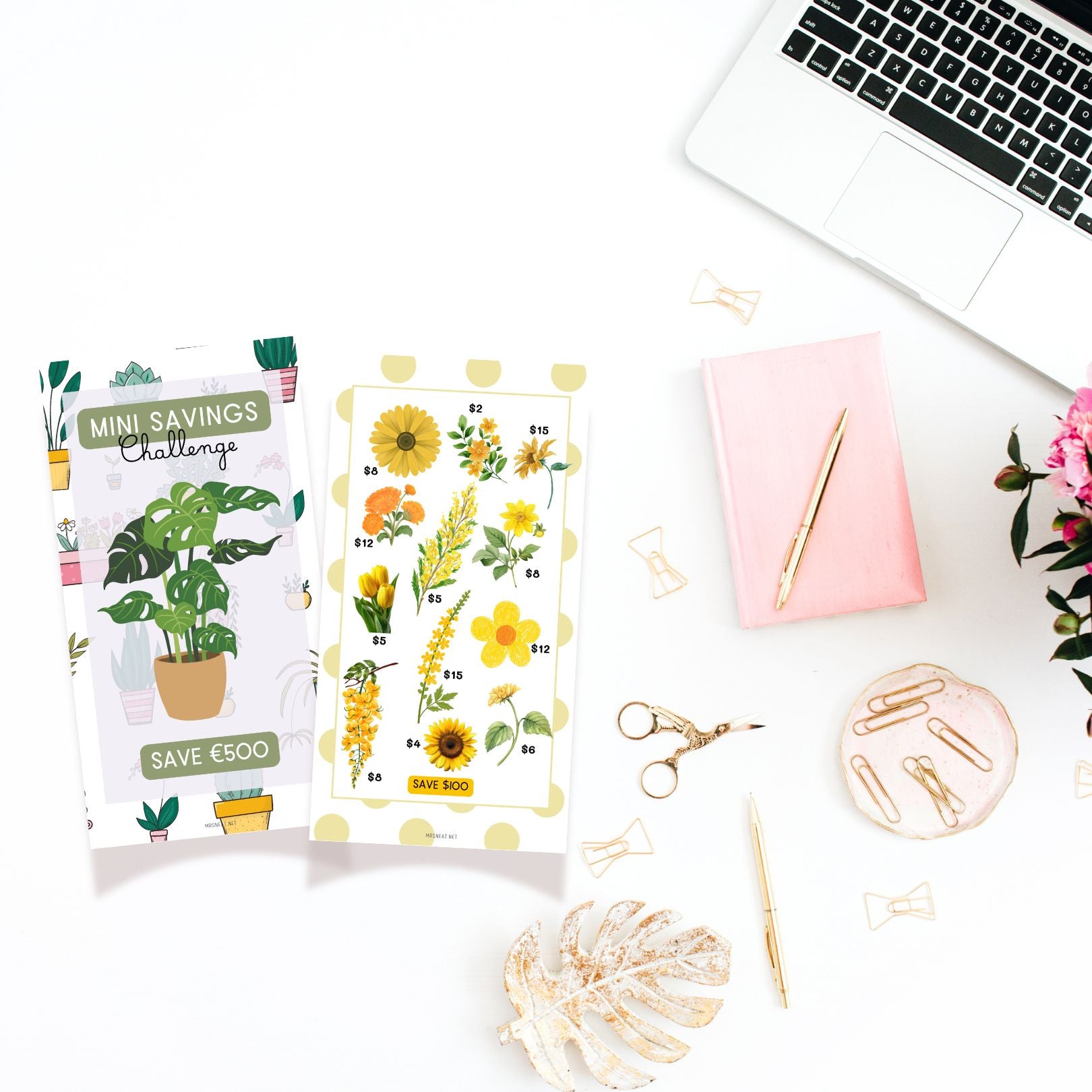 Two plant-themed saving challenge cards on a desk with a laptop, notebook, and office supplies.