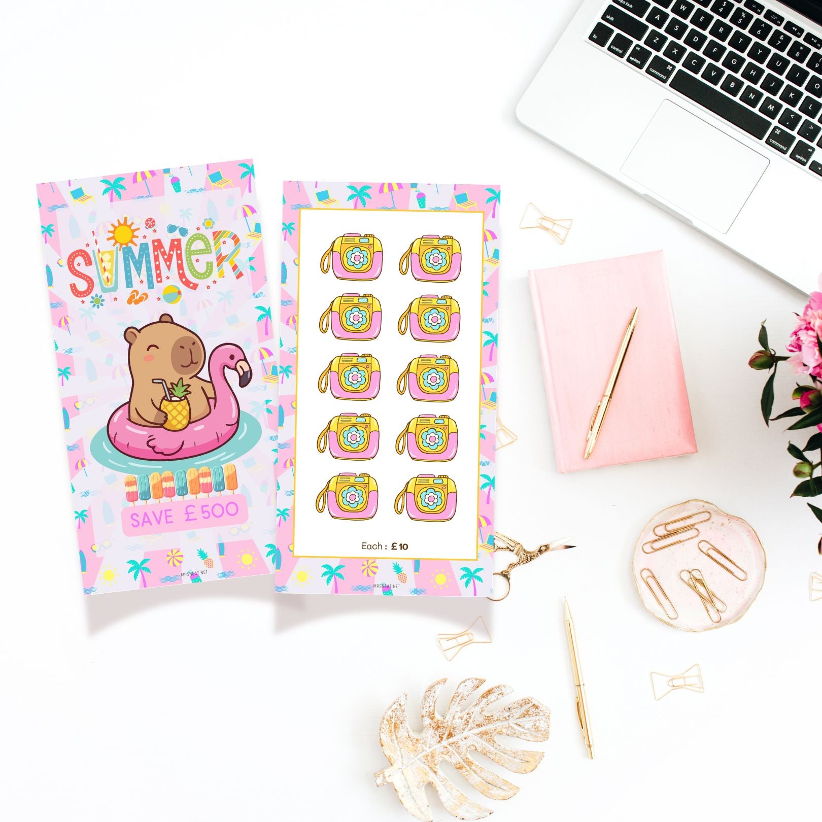 Sticker sheets with summer-themed designs on a desk with a laptop and stationery items.