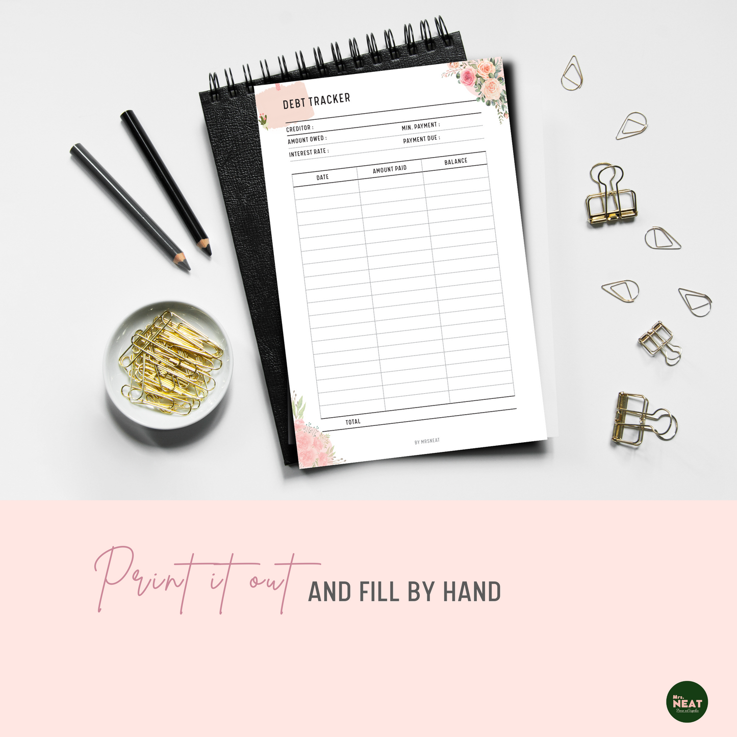Floral Pink Debt Payment Tracker Planner Printed out and put on the black book with stationery surround