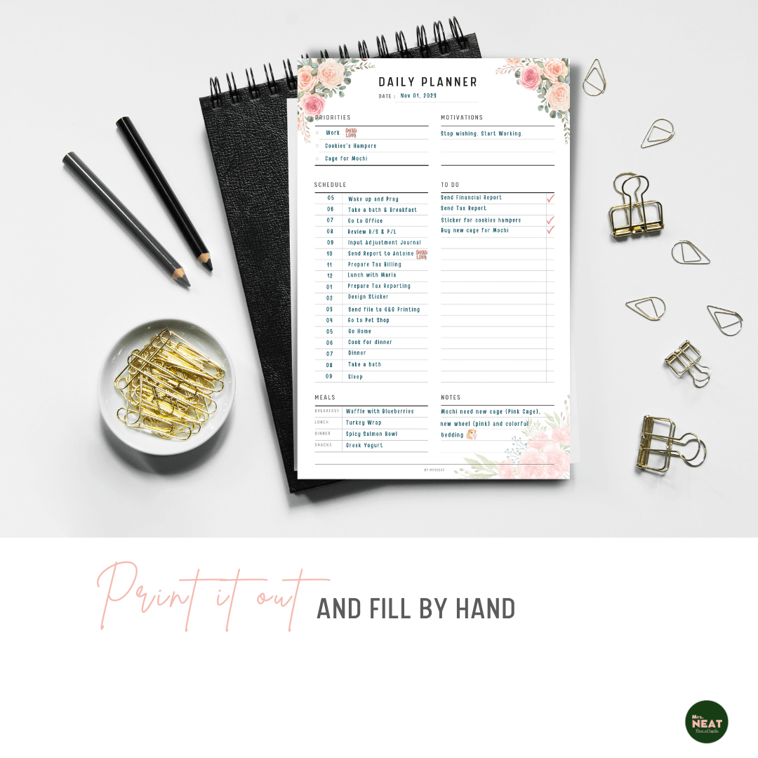 Pink Floral Daily Planner Printable printed out on the paper with stationery surround